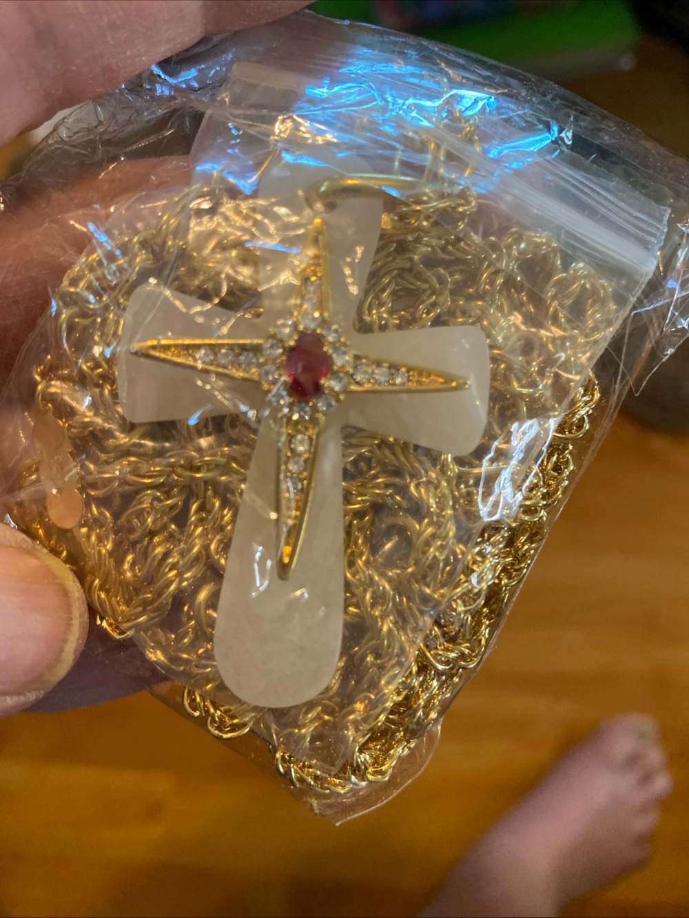 Gold-Tone Cross Pendant Necklace with White Inlay and Red Stone